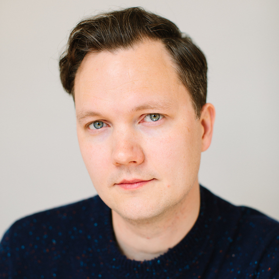A headshot of Carl Atiya Swanson.