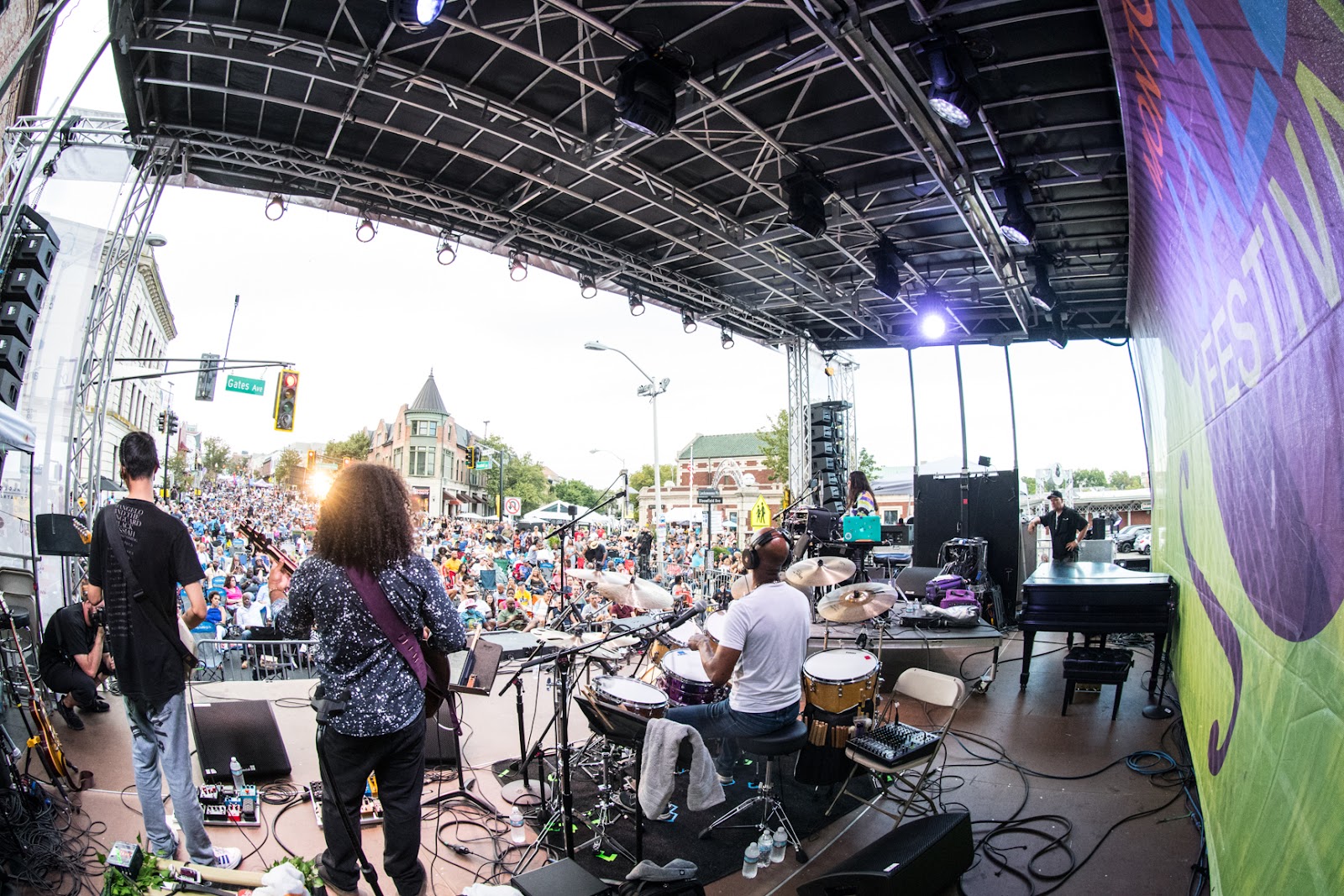 A vibrant jazz festival crowd enjoying music and art in 2025